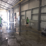 image of a team cleaning a warehouse