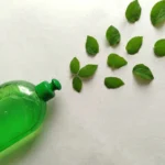 Eco-Friendly Liquid Soap Bottle with Green Leaves - Natural Cleaning Concept