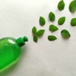 Eco-friendly green plastic bottle with leaves symbolizing natural, organic, and biodegradable cleaning products. | Eco-Friendly Cleaning Services in Brisbane